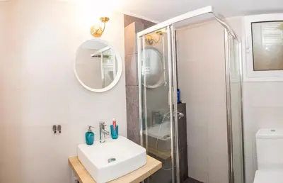 a bathroom with a sink and a shower at Gazi District Next To Subway 2 in Athens
