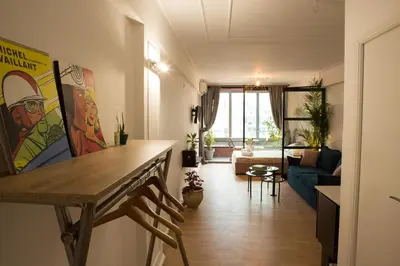 a living room with a table and a couch at Mosaics aprtm in Parliament square with Acropolis View in Athens