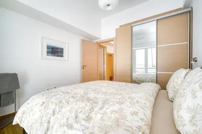 a bedroom with a large bed and a window at Stylish, Sunny New 2 Bedroom, Prime Central Athens in Athens
