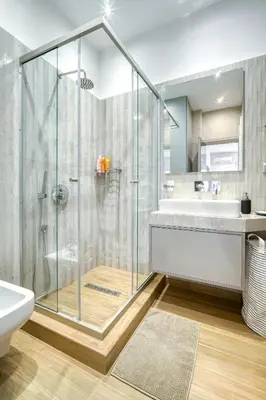a bathroom with a glass shower and a sink at Stylish, Sunny New 2 Bedroom, Prime Central Athens in Athens