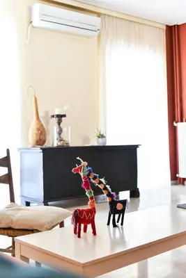 a table with two toy animals on top of it at Homie Apartment next to Acropolis in Athens