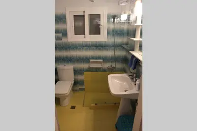 a bathroom with a toilet and a sink at Vravrona Sea View Country House near Athens in Vravrona