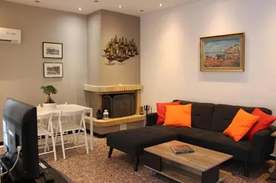 a living room with a couch and a table at Vravrona Sea View Country House near Athens in Vravrona
