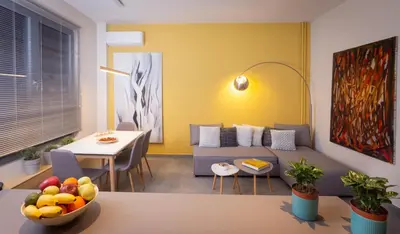 a living room with a couch and a table at 27 times Athens in Athens