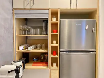 a kitchen with a stainless steel refrigerator in a kitchen at 27 times Athens in Athens
