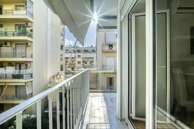 a balcony with a view of a building at Bright Spacious Luxury Apartment in Prime Central Athens in Athens