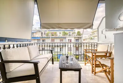 a living room with a couch and a table at Bright Spacious Luxury Apartment in Prime Central Athens in Athens