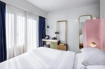 a bedroom with a white bed and a mirror at Gatsby Athens in Athens