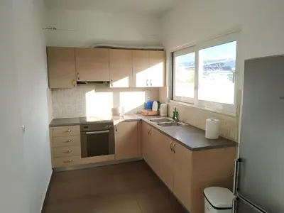 a small kitchen with a sink and a window at Pantazopoulou square apartment (central railway) in Athens