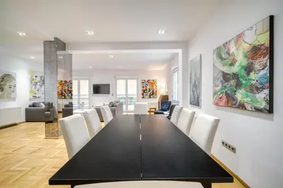 a dining room with a black table and chairs at Stunning Central 180m2 4 Bedroom 3 Bathroom, Sleeps 10 Guests in Athens