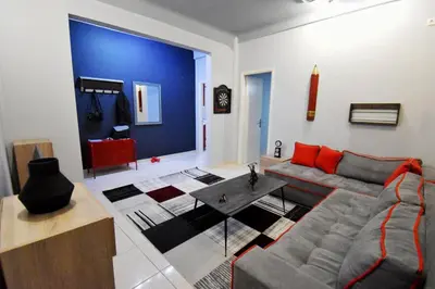 a living room with a couch and a table at Rock, few steps from Acropolis rocks! in Athens
