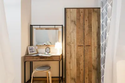 a dressing room with a desk and a mirror at Syntagma private sweet safe double rooms with shared bathroom in Athens