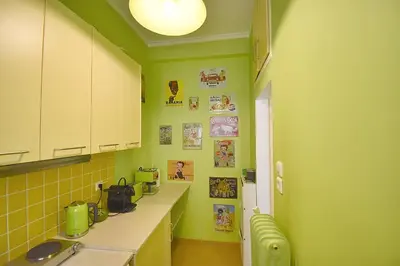 a kitchen with lime green walls and a sink at Check Point - Plaka in Athens