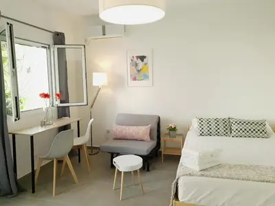 a small room with a bed and a desk and a bed and a desk at Cozy Studio 4U Gazi - Center Athens in Athens