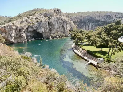 a river with a bridge in the middle of a mountain at Thelfi Luxury studio in Attica - close to varkiza beach - Sea view in Vari