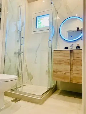 a bathroom with a shower and a sink at Thelfi Luxury studio in Attica - close to varkiza beach - Sea view in Vari