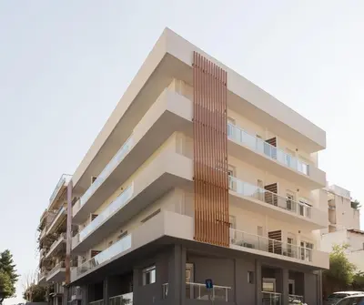 an apartment building with a wooden facade at The Aristotelian Suites by Athens Stay in Athens