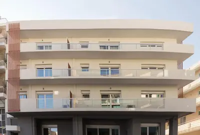 an external view of a building with balconies at The Aristotelian Suites by Athens Stay in Athens