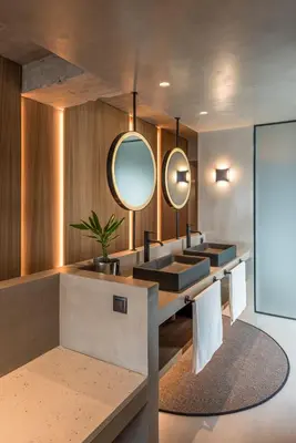 a bathroom with two sinks and a mirror at Urban Suites in Athens