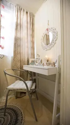 a dressing table with a chair and a mirror at Hidden Paradise in Piraeus
