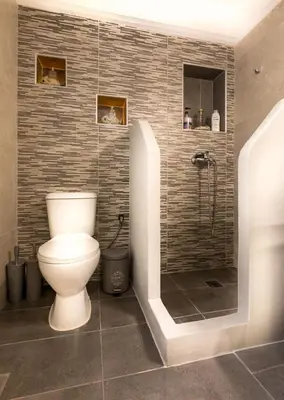 a bathroom with a toilet and a shower at Hidden Paradise in Piraeus
