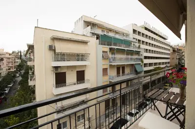 a balcony of a building with a bench on it at Acropolis Now! 2BR in central Athens in Athens