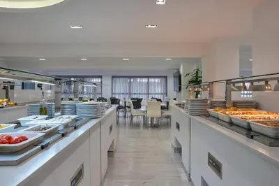 a buffet line in a hotel with plates of food at Boss Boutique Athens by Prima Hotels in Athens