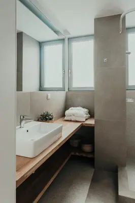 a bathroom with a sink and a mirror at Stylish Suite, by MGM Residencies in Athens
