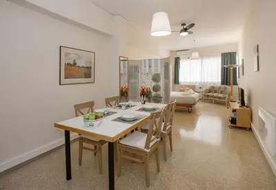 a dining room with a table and chairs at Central apartment on pedestrian street by GHH in Athens