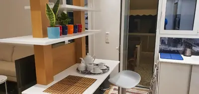 a room with a table with cups on a shelf at The Six Museums central Athens Stadium 4pers apart in Athens