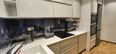 a kitchen with white cabinets and a city on the wall at The Six Museums central Athens Stadium 4pers apart in Athens