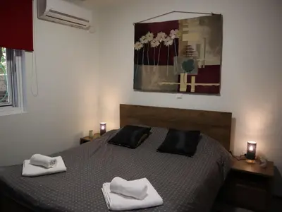 a bedroom with a bed with two towels on it at Nefeli in Athens