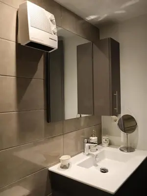 a bathroom with a white sink and a mirror at Nefeli in Athens