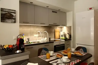 a kitchen with a table with food on it at Nefeli in Athens