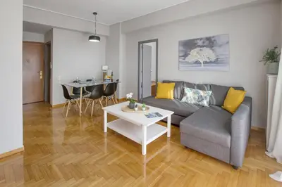 a living room with a couch and a table at Cozy apartment in Syntagma-Plaka by GHH in Athens