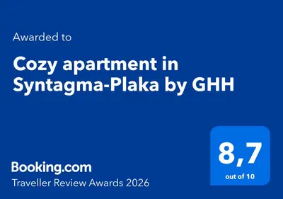 a blue sign with the words cozy appointment in syphania plaza by chikh at Cozy apartment in Syntagma-Plaka by GHH in Athens