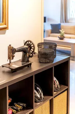 a sewing machine sitting on a table in a living room at Boutique77 Luxury Apartment in Athens