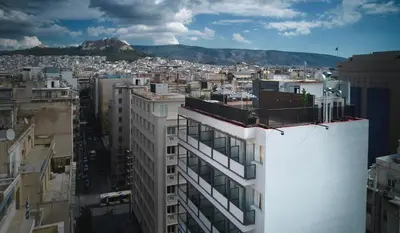a view of a city from the top of a building at Max Brown Hotel Downtown Part of Sircle Collection Formally known as Dave Red in Athens