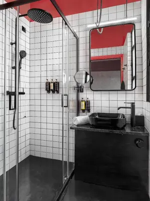 a bathroom with a shower with a sink and a mirror at Max Brown Hotel Downtown Part of Sircle Collection Formally known as Dave Red in Athens