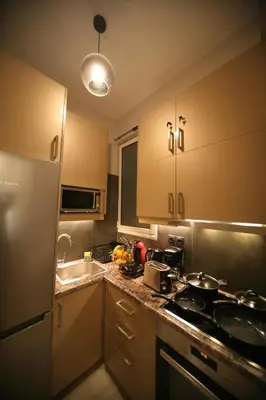 a kitchen with a sink and a stove top oven at Denise Luxury Apartment-Centre of Athens,Kolonaki in Athens