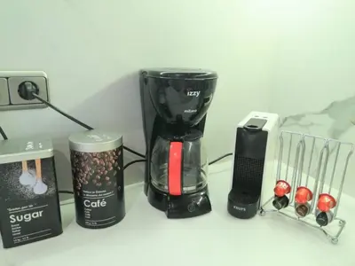 a coffee maker and other items on a counter at Luxurious apartment in Acropolis in Athens