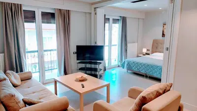 a living room with a couch and a bed at Luxurious minimal apartment in Acropolis in Athens