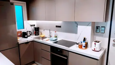 a kitchen with a sink and a counter top at Luxurious minimal apartment in Acropolis in Athens