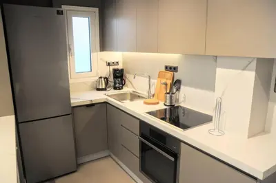 a kitchen with a sink and a counter top at Luxurious minimal apartment in Acropolis in Athens