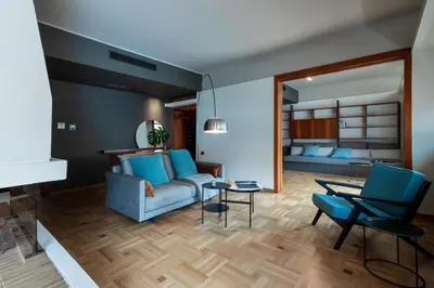 a living room with a couch and a table at The H Experience Boutique Apartments Athens - free parking and fiber internet in Athens