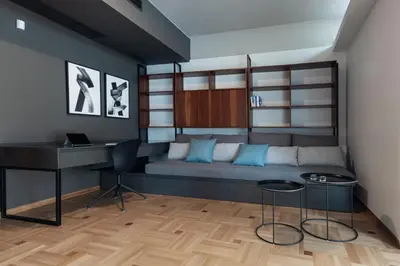 a bedroom with a bed with a desk and a table at The H Experience Boutique Apartments Athens - free parking and fiber internet in Athens