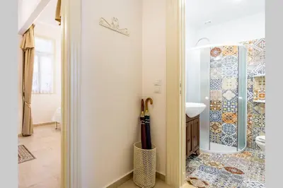 a bathroom with a shower and a sink in a room at Neoclassical apartment with 2 bedrooms in Piraeus in Piraeus