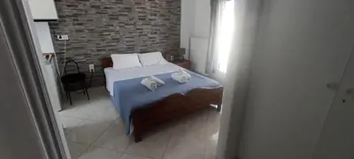 a bedroom with a bed with two stuffed animals on it at Michali's Koukaki Apartment (metro Sygrou/Fix) in Athens