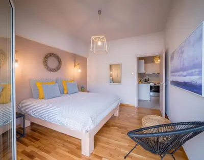 a bedroom with a large white bed in a room at Brand new aprtm touching Acropolis in Athens