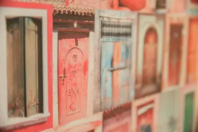 a row of toy buildings with a red door at Cozy renovated flat in Koukaki in Athens